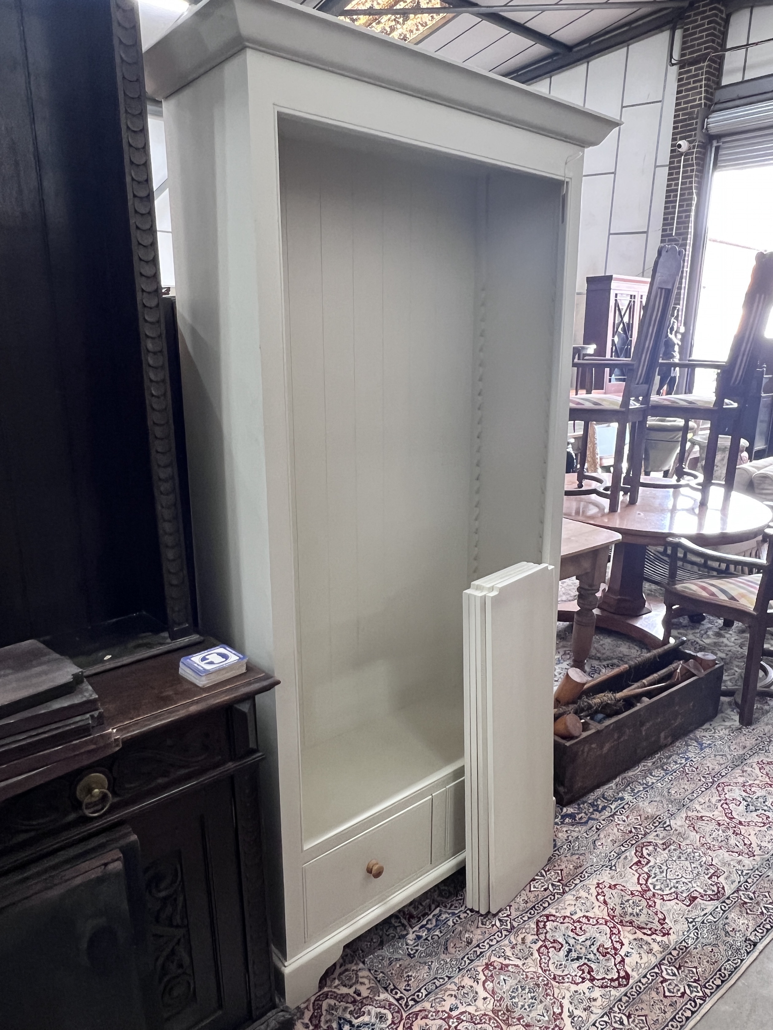Neptune Furniture: A calico painted open bookcase, width 112cm, depth 43cm, height 209cm